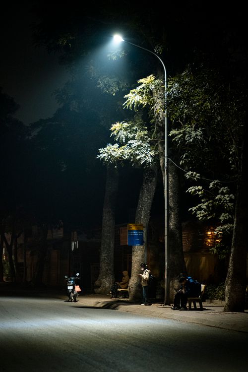Night street under lamp post in Hanoi, Vietnam