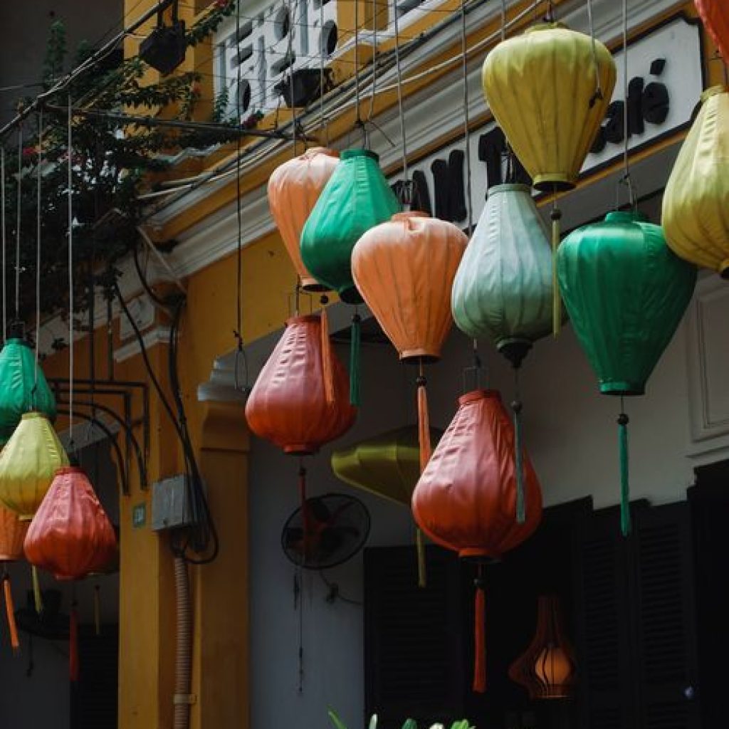 Colorful lanterns hanging on yellow-walled streets of Hoi An Ancient Town