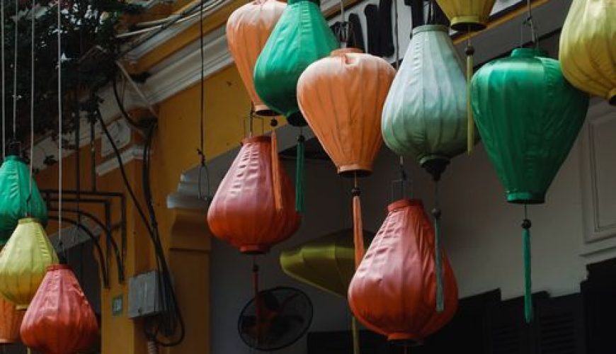Colorful lanterns hanging on yellow-walled streets of Hoi An Ancient Town