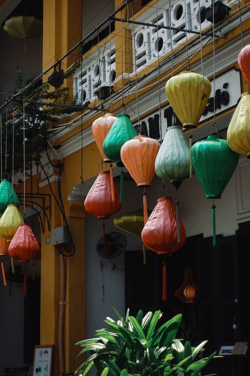 Colorful lanterns hanging on yellow-walled streets of Hoi An Ancient Town