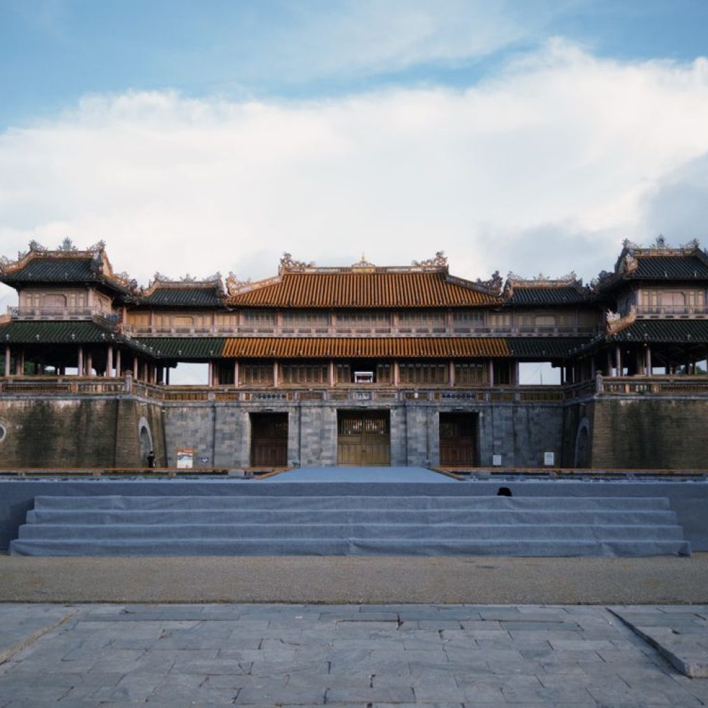 The historic gate of Hue Imperial City (Citadel) under a blue sky in Vietnam