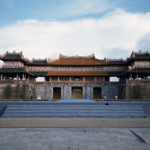 The historic gate of Hue Imperial City (Citadel) under a blue sky in Vietnam
