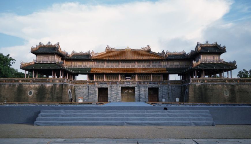 The historic gate of Hue Imperial City (Citadel) under a blue sky in Vietnam
