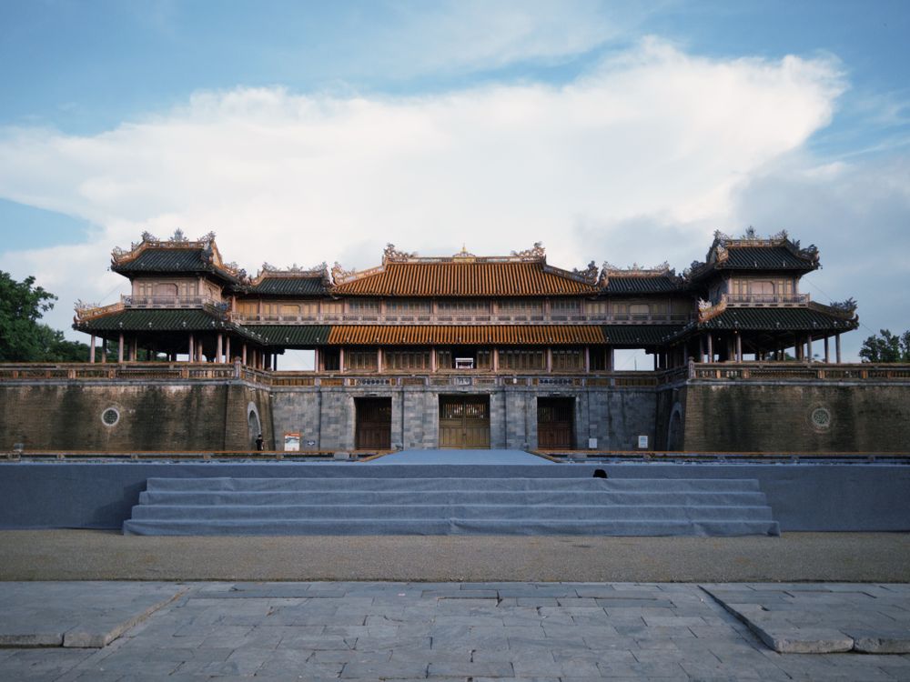 The historic gate of Hue Imperial City (Citadel) under a blue sky in Vietnam