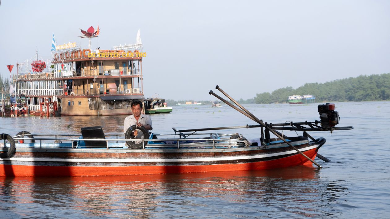 Traditional wooden boat on the Mekong River near Can Tho, Vietnam