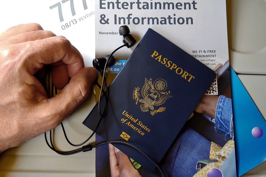 US passport and travel documents on an airplane seat — travelers to Vietnam will need to monitor official sources for when health declarations become active