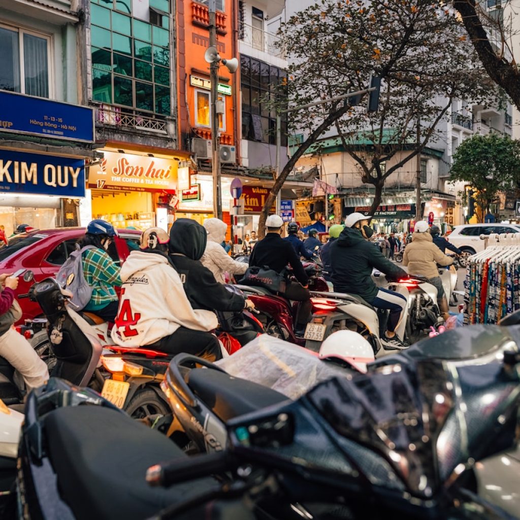 Heavy motorbike traffic on a street in Hanoi Vietnam