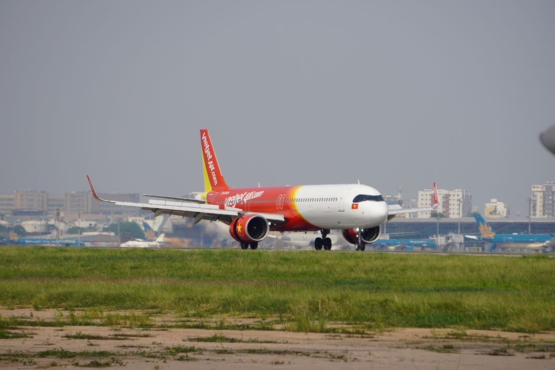 A commercial airplane on the runway at Tan Son Nhat International Airport in Ho Chi Minh City, Vietnam — one of the airports where the new health declaration rule will be enforced