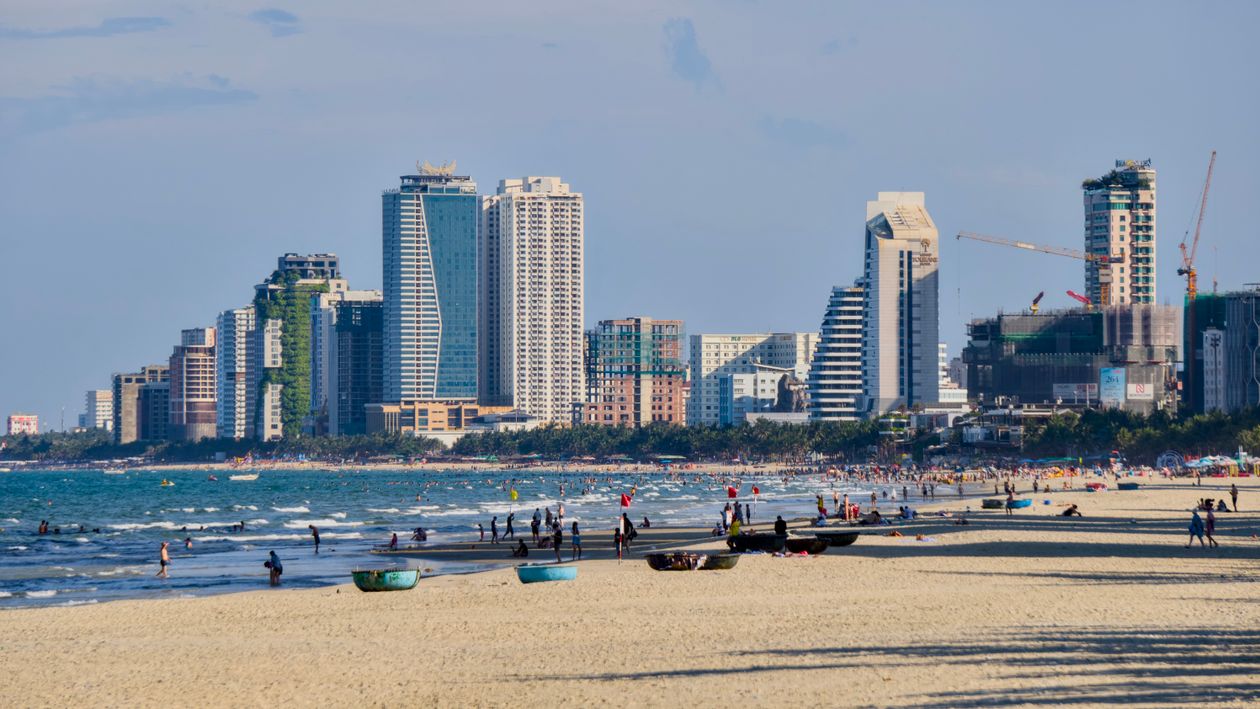 My Khe Beach in Da Nang with city skyline behind — central Vietnam has its best beach weather in July