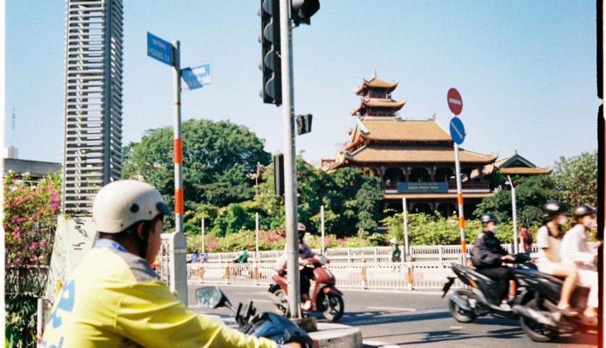 A busy street scene in Ho Chi Minh City, showing motorbikes and pedestrians — the energy of Vietnam travel in July