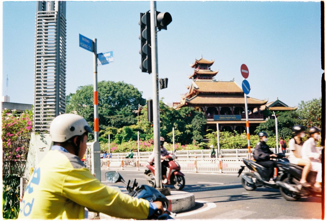 A busy street scene in Ho Chi Minh City, showing motorbikes and pedestrians — the energy of Vietnam travel in July