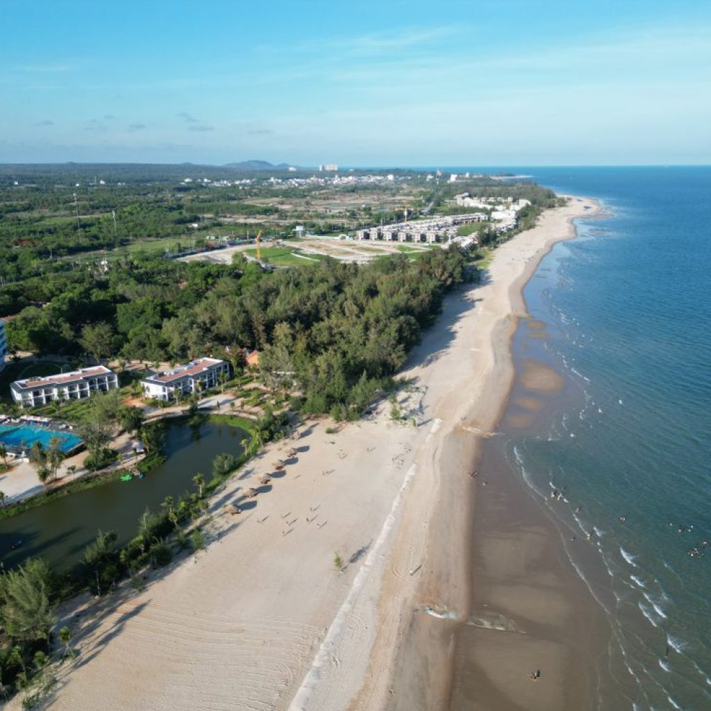 Aerial view of Ho Tram beach coastline with luxury resorts along the shore