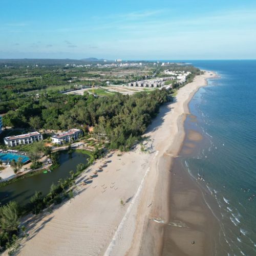 Aerial view of Ho Tram beach coastline with luxury resorts along the shore