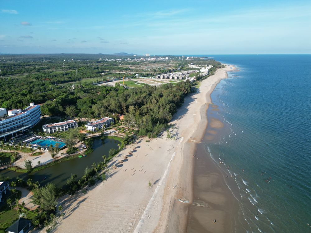 Aerial view of Ho Tram beach coastline with luxury resorts along the shore