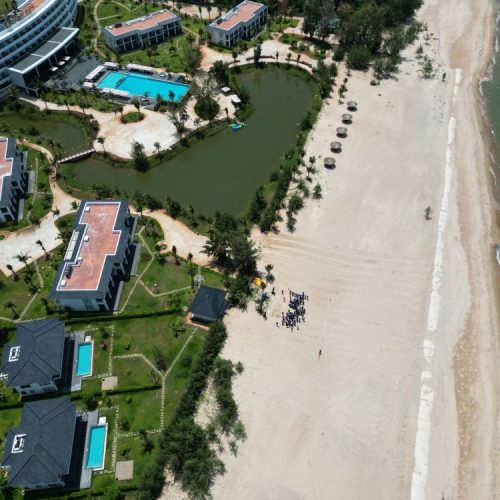 Luxury beach resort swimming pool overlooking Ho Tram beach in Vietnam