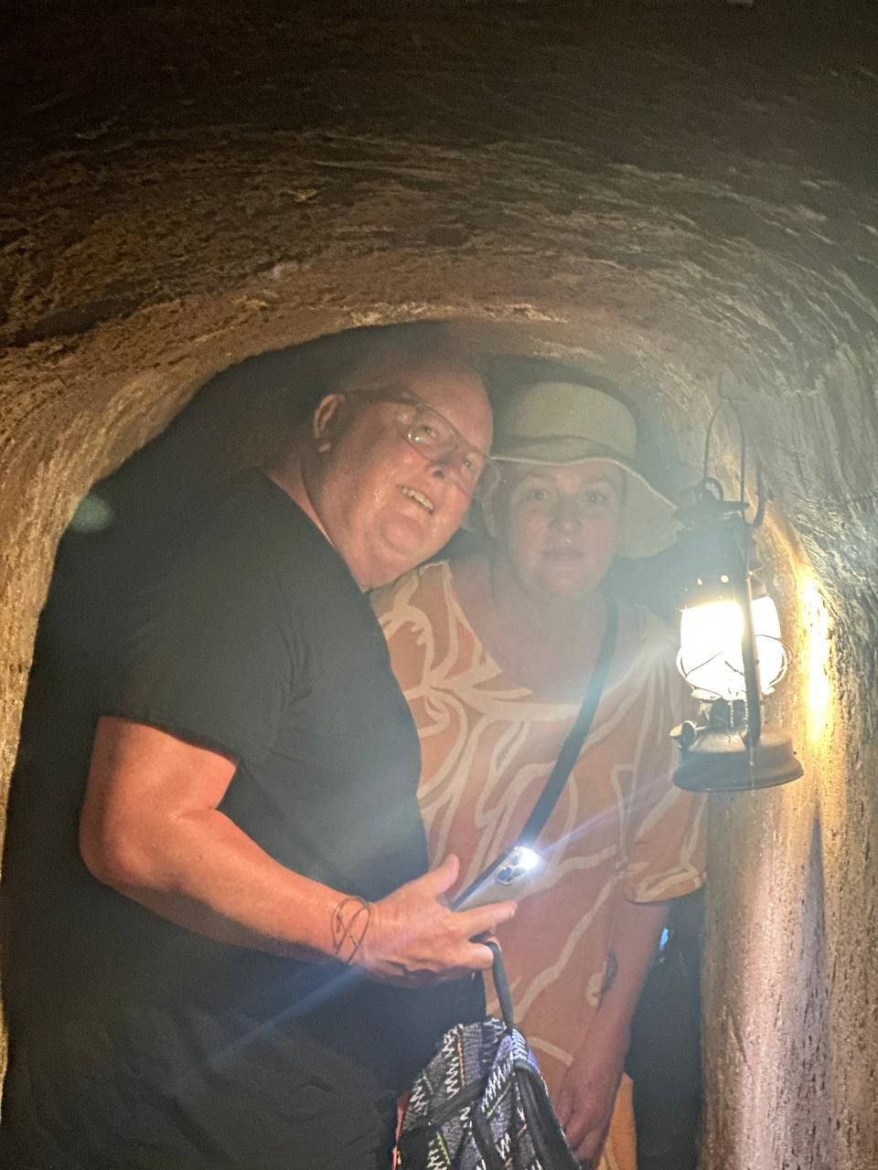 Exploring underground tunnels with flashlight — Long Phuoc tunnel experience