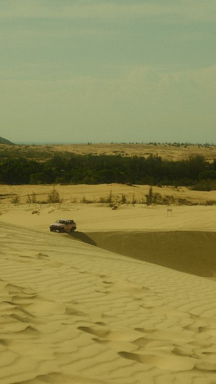 Sand dunes stretching across the landscape in Mui Ne, Vietnam