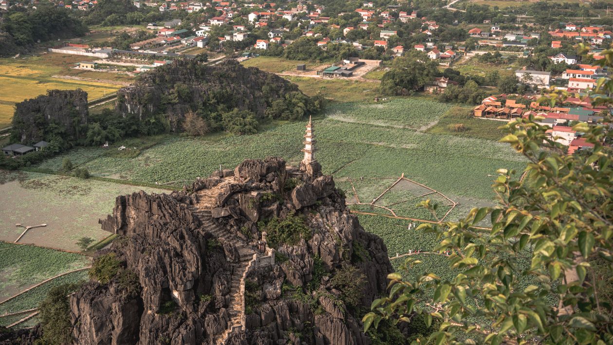 Aerial view of Mua Cave viewpoint overlooking limestone mountains in Ninh Binh