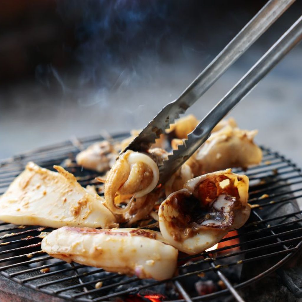 Grilled seafood on a charcoal grill in Nha Trang, Vietnam