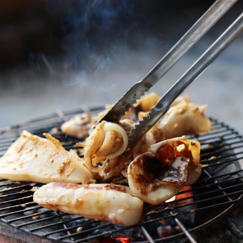 Grilled seafood on a charcoal grill in Nha Trang, Vietnam