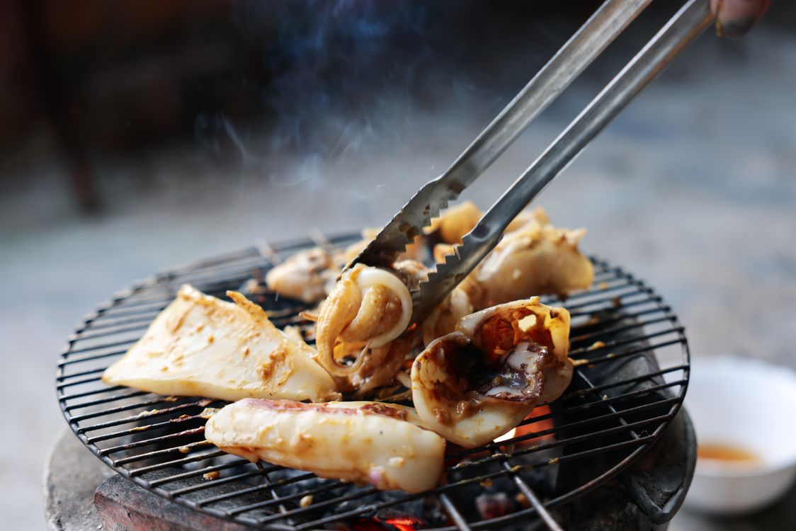 Grilled seafood on a charcoal grill in Nha Trang, Vietnam