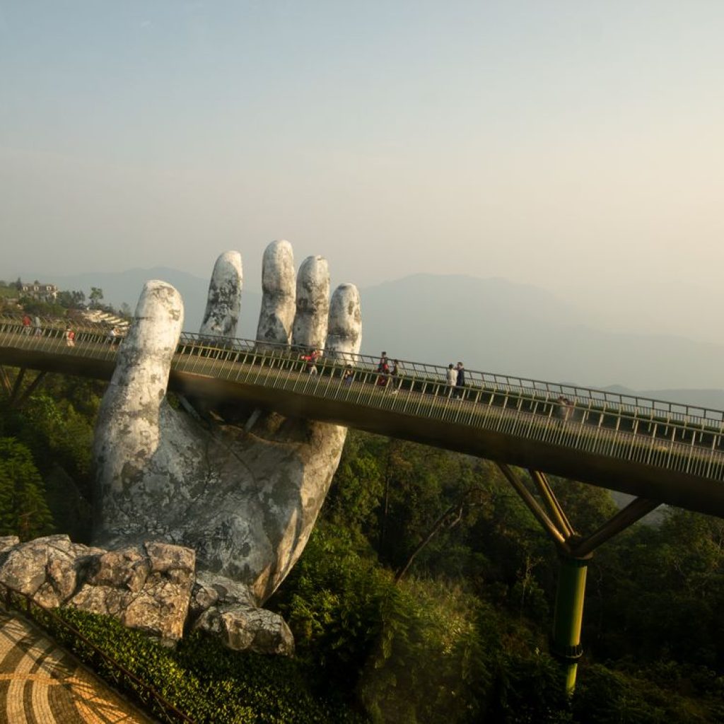 Golden Bridge at Ba Na Hills in Da Nang, held by giant stone hands