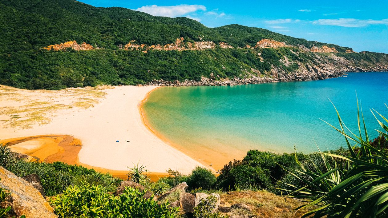 Empty sandy beach with turquoise water on the Phu Yen coast