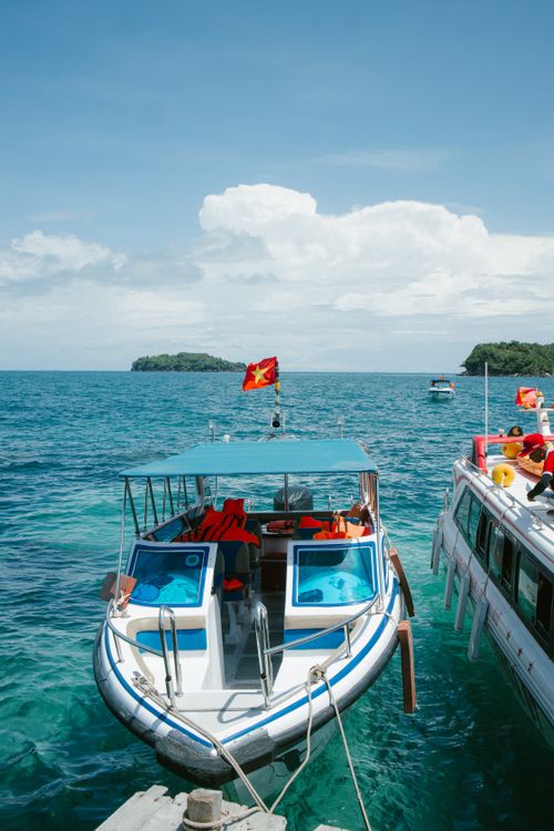 Speedboat at a tropical pier ready to carry visitors to Cham Island from Hoi An
