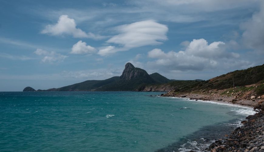 Con Dao island coastline — mountains rise straight out of the sea, one of 16 islands in Vietnam's Con Dao archipelago