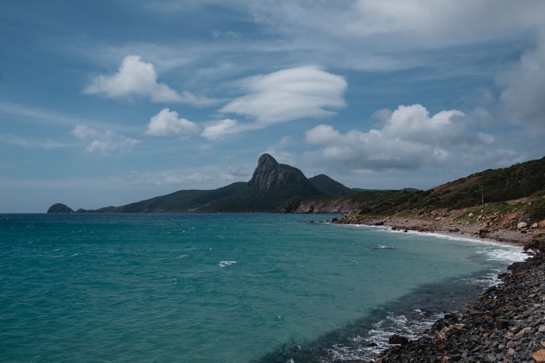 Con Dao island coastline — mountains rise straight out of the sea, one of 16 islands in Vietnam's Con Dao archipelago