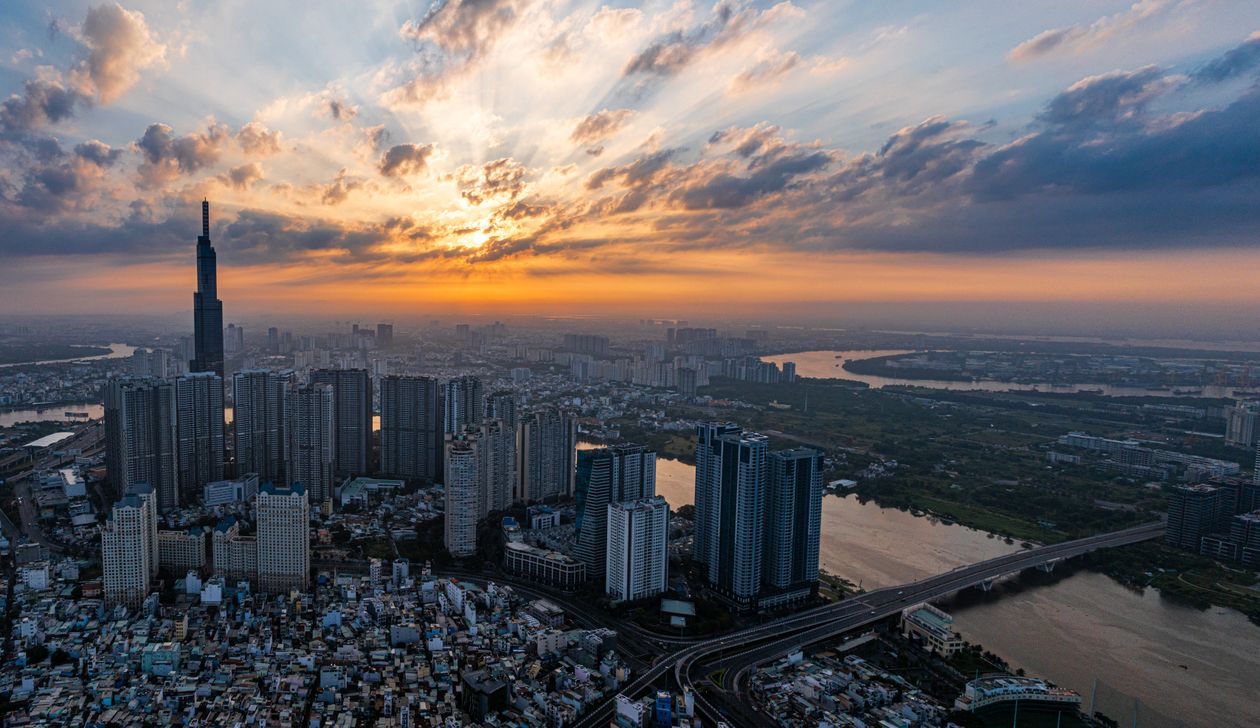 Ho Chi Minh City skyline at sunset above the Saigon River