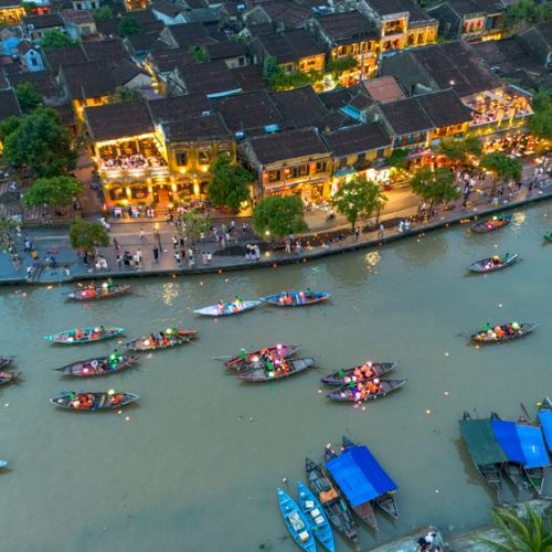 Hoi An Ancient Town lit up with lanterns at night — staying here puts you in the middle of it all
