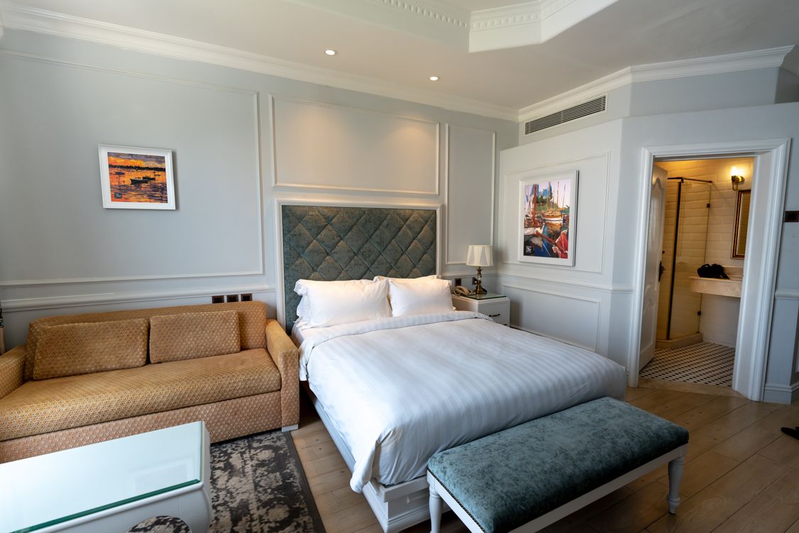 Modern hotel room with a comfortable bed, typical mid-range Saigon standard