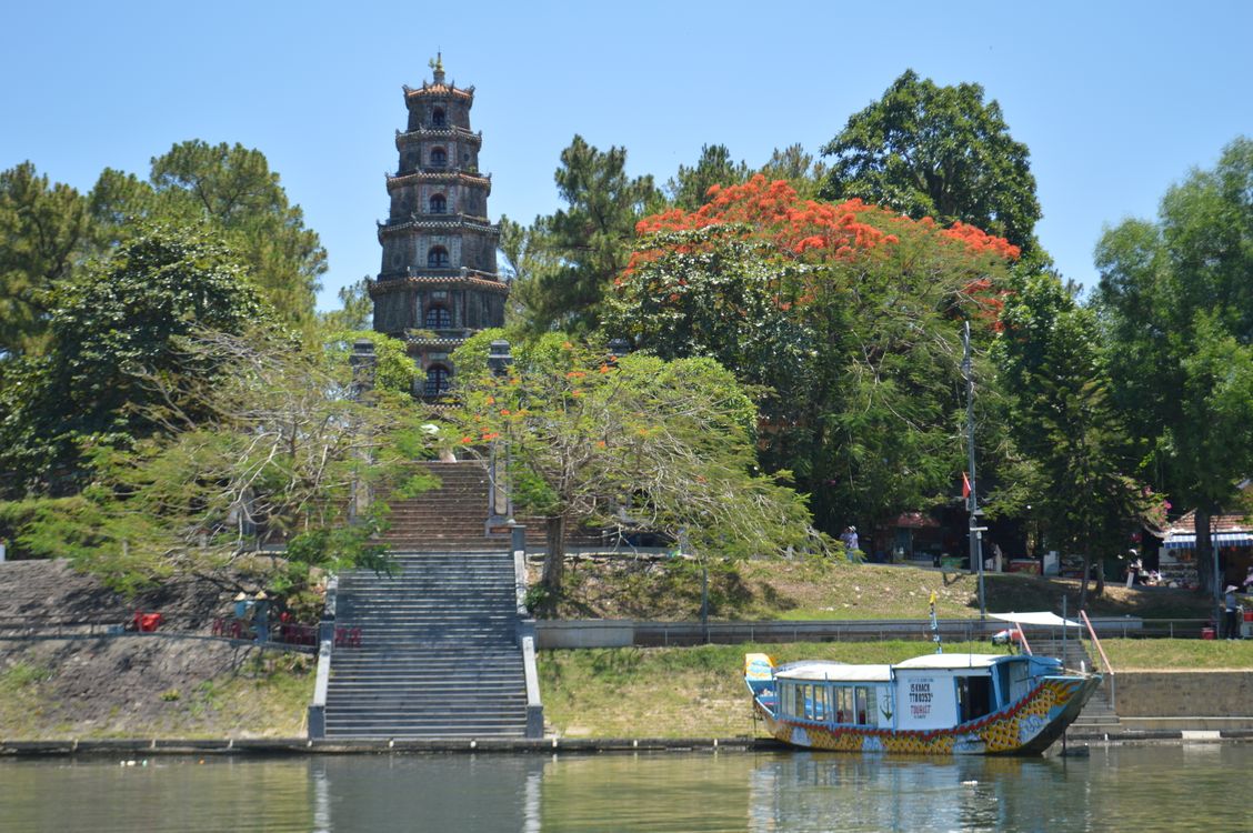 Thien Mu Pagoda and a dragon boat on the Perfume River in Hue