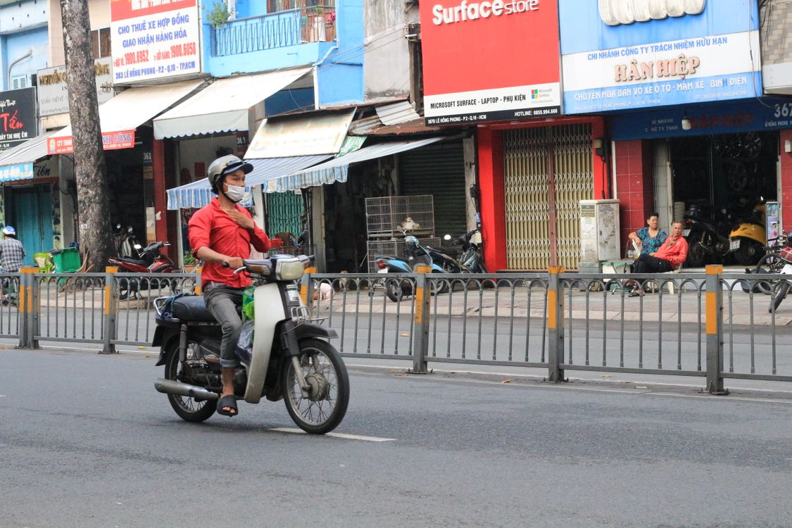 Motorbike rider on a busy Ho Chi Minh City street