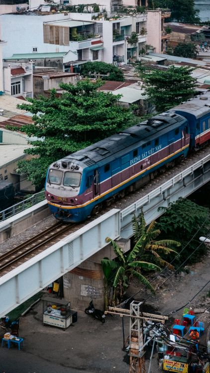 Vietnam railway train crossing a bridge in Saigon