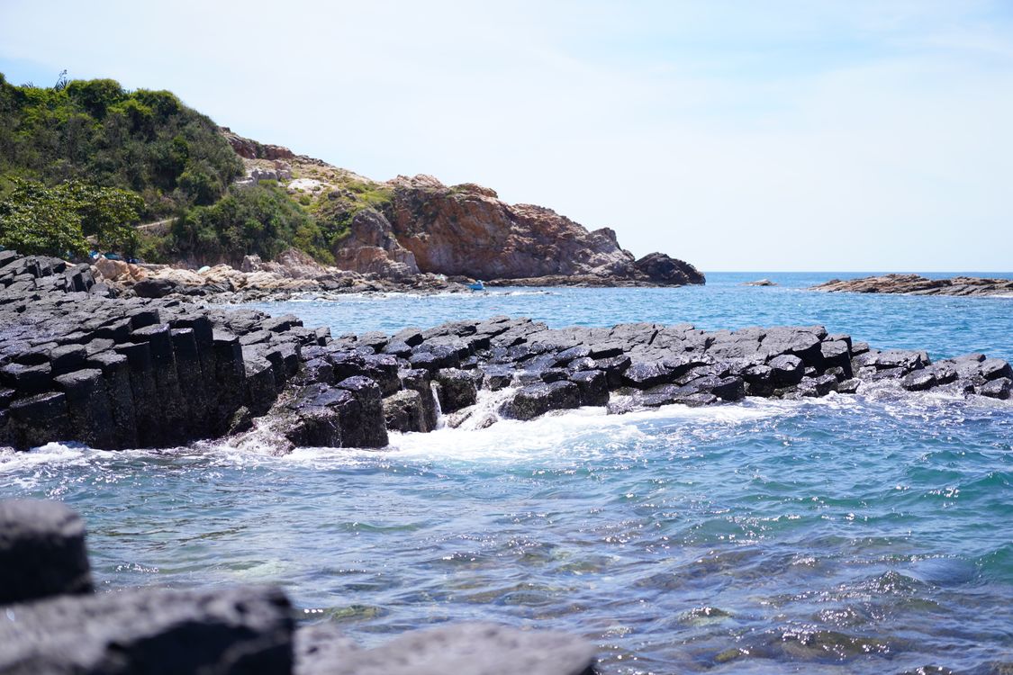Hexagonal basalt rock columns by the sea in Tuy An, Phu Yen