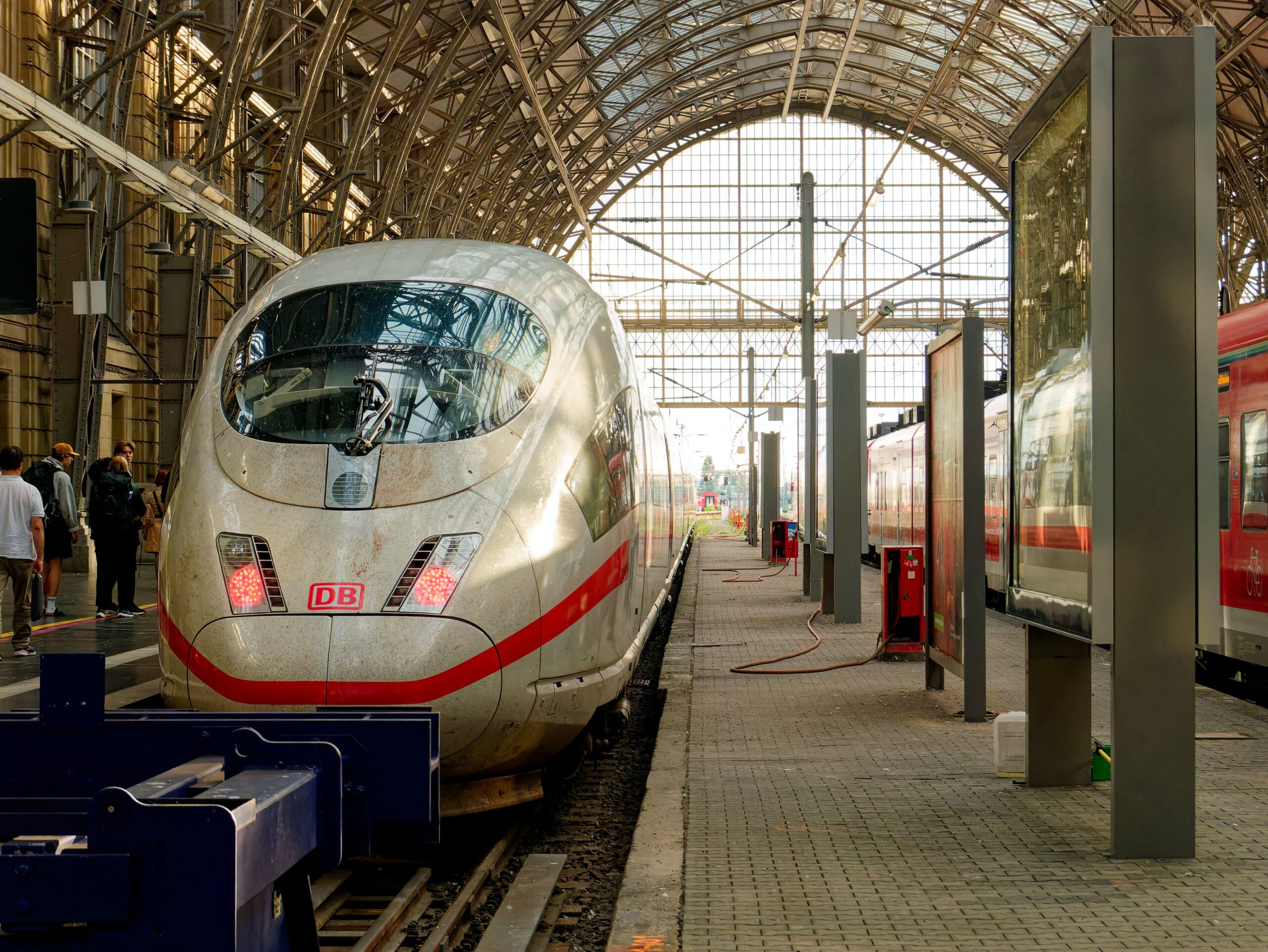 A high-speed train under the roof at a Frankfurt railway station.