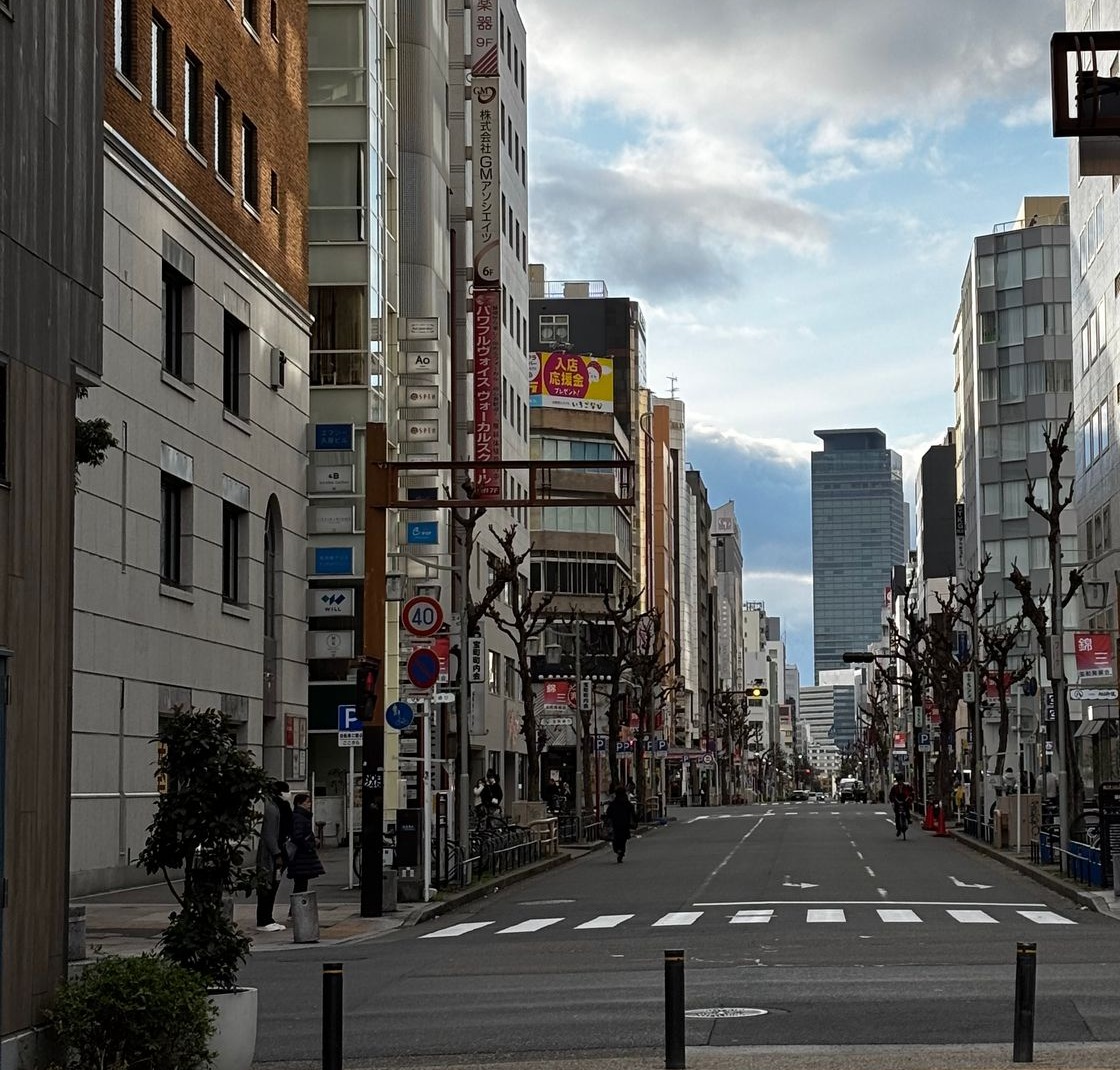 Daytime street and modern building facades in Nagoya