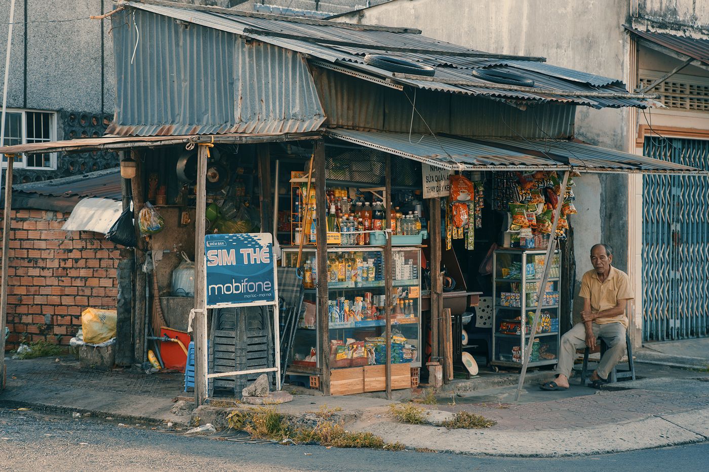 A small street-side shop in Sa Dec with goods displayed at the entrance