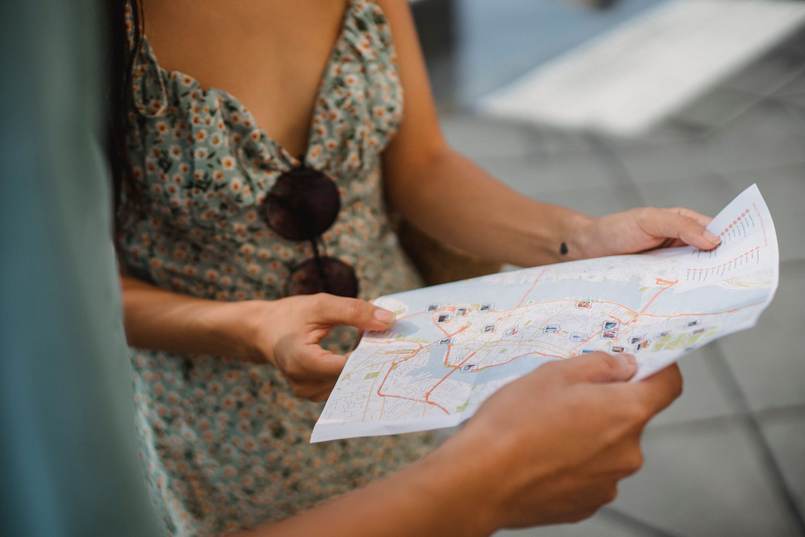 Two travelers consult an unidentified city map
