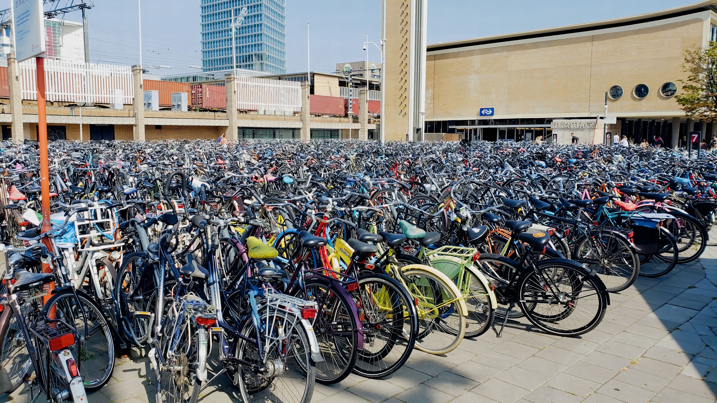 Rows of bicycles parked outside Eindhoven Central Station.