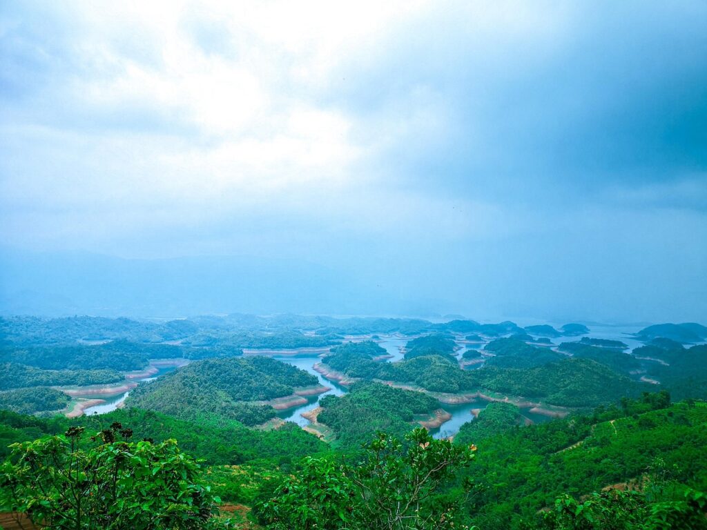 A highland lake surrounded by green hills