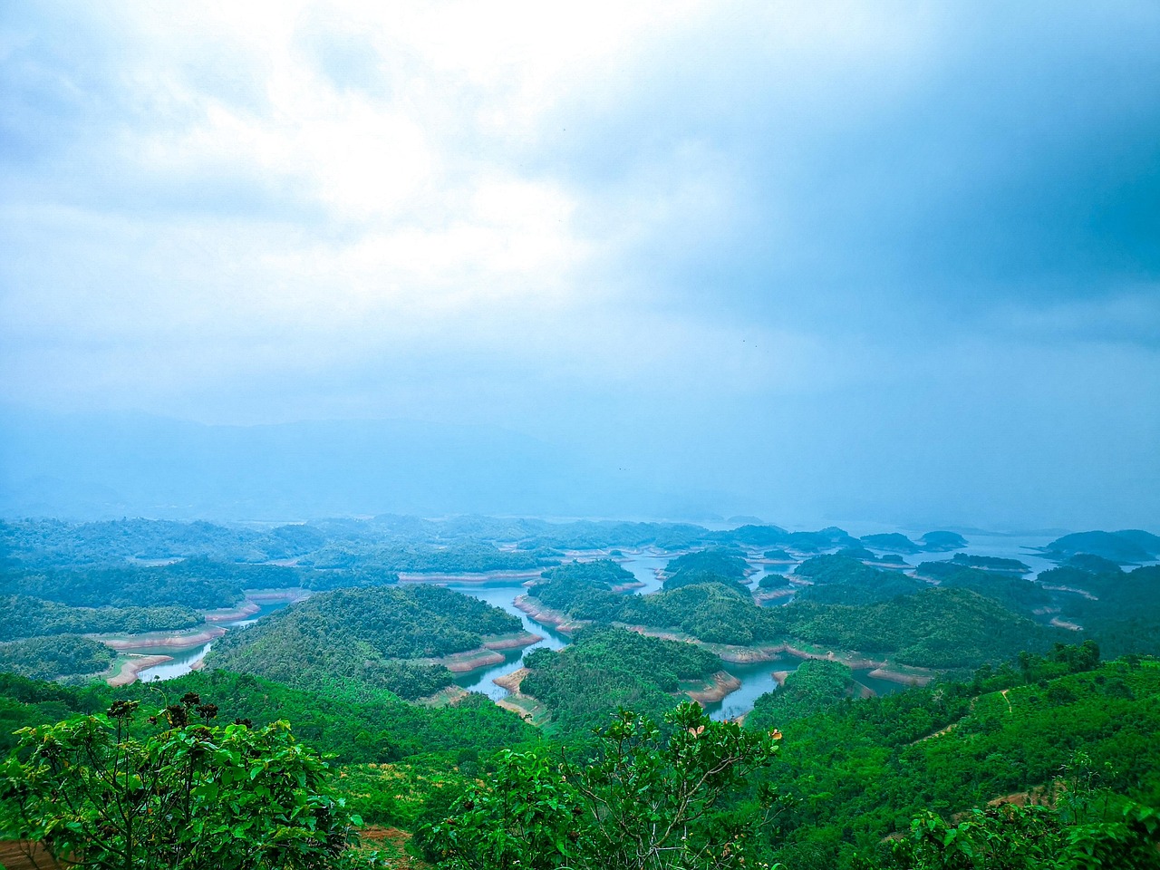 A highland lake surrounded by green hills