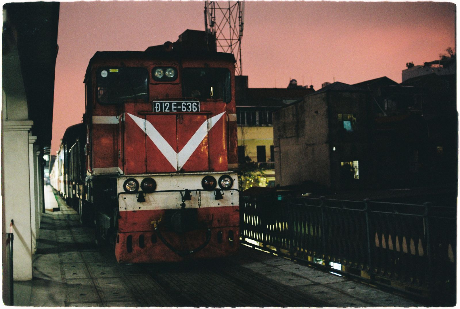Vietnamese passenger locomotive at a railway platform in Hanoi