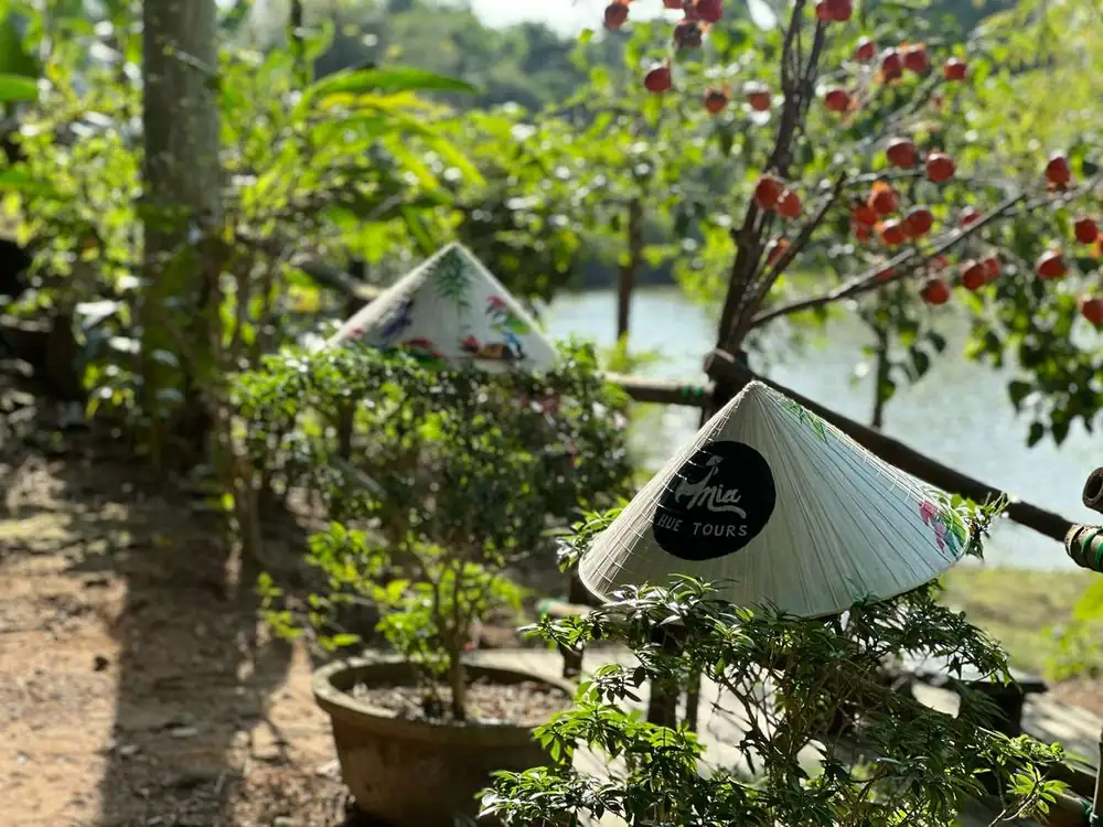 Conical hats by the lake at the souvenir workshop near Hue