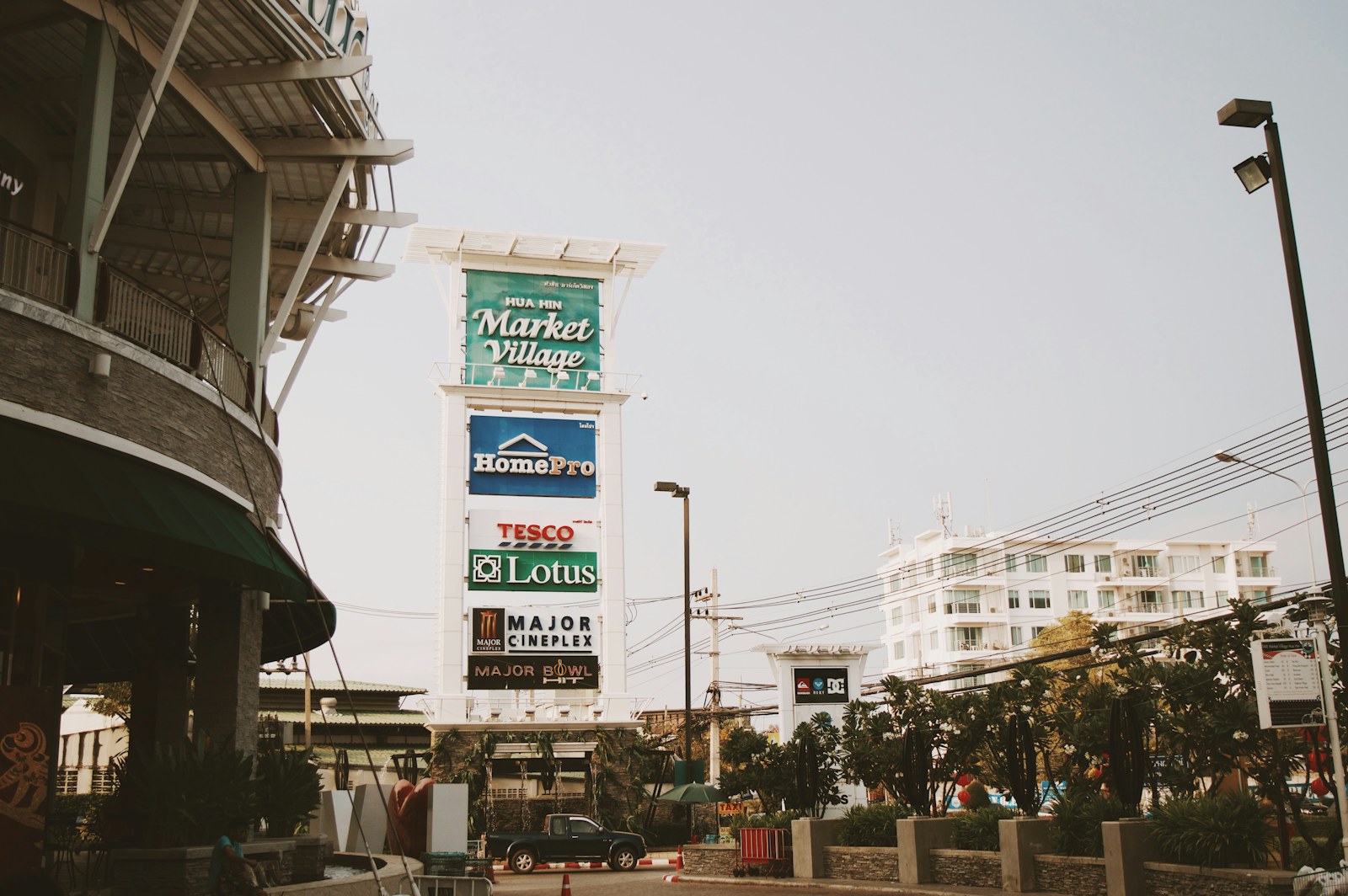 Entrance and tall Hua Hin Market Village shopping-centre sign