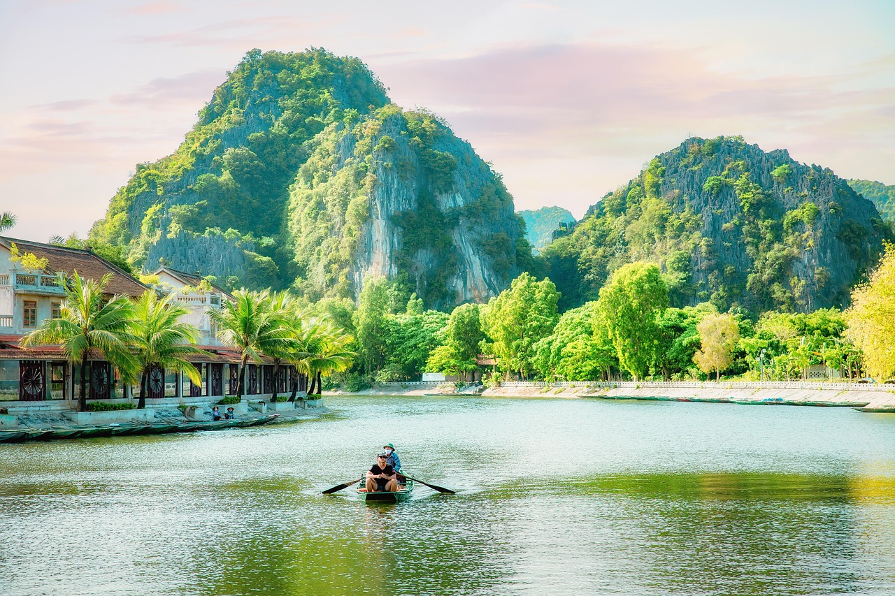 Tourist boats and limestone karsts at Tam Coc in Ninh Binh