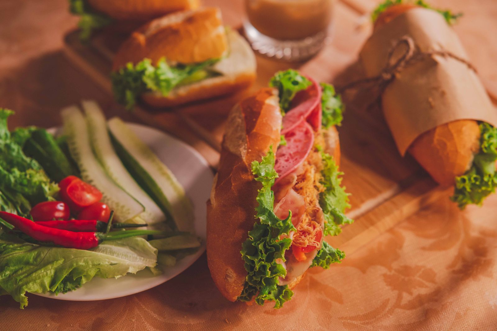 Vietnamese bánh mì filled with meat, lettuce, cucumber and chili