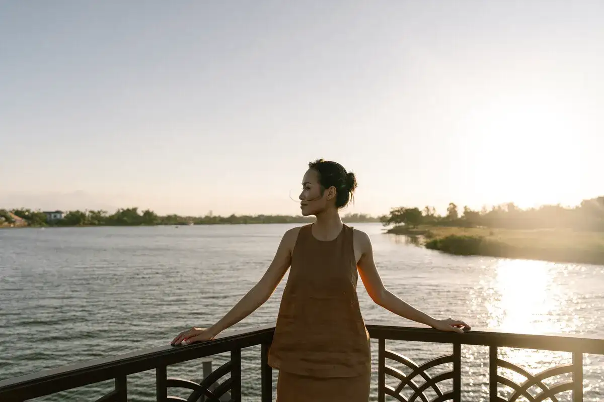 woman river cruise sunset